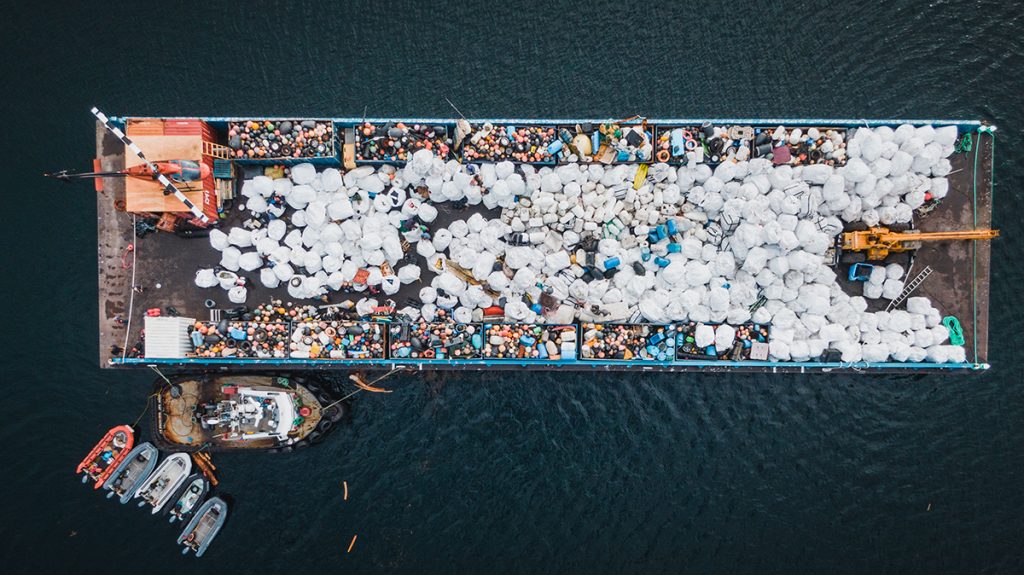 An aerial view of the barge filled with bags of garbage